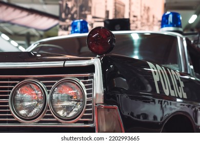 In Front Of An Old American Police Car