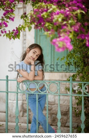 in front of the old house with bougainvilleas