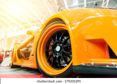 Front Of An Orange Generic Sport Car In Sunlight