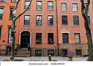 The front of an ornate brownstone building in an iconic neighborhood of Brooklyn in New York City