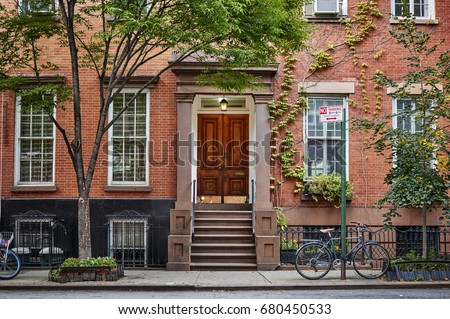 The front of an ornate brownstone building in an iconic neighborhood of Brooklyn in New York City