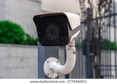 The front panel of a 4K IP camera mounted on a pole. Barrier testing and control