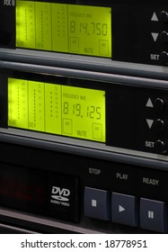 Front panel of a hi-fi audio system with two green LCD displays