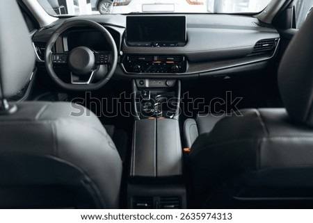 Front panel with steering wheel. Interior of the modern car, close up view.