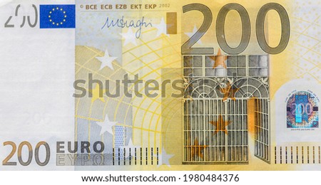 Front part of 200 euro banknote close-up with small details. European currency. Inflation, business, economics and finance theme.