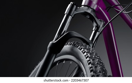 Front part of a new mountain bike close up on a black background. Studio shot. Professional sport equipment. - Shutterstock ID 2203467307