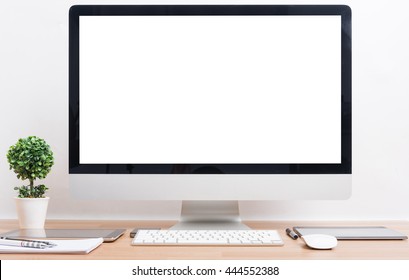 Front of PC computer monitor, Mobile Phone, magic mouse and tablet and keyboard on white table office desk workspace for work from home - Powered by Shutterstock