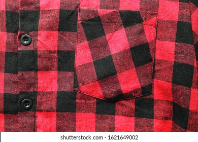 Front Pocket On Flannel Tartan Shirt With Buffalo Check Plaid Pattern. Casual Red & Black Checkered Button Down Shirt With Classic Scottish Pattern, Close Up Top View Of Trendy Women's And Men's Top 