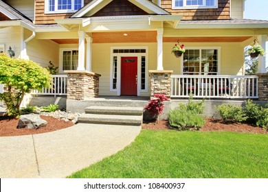 Front Porch Of The American House With Red Door.