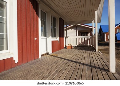 Front porch empty American wooden outdoor  walkout verandah patio deck of wooden cottage - Powered by Shutterstock