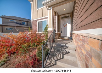 Front Porch Exterior Of A House With Messy Front Yard Garden