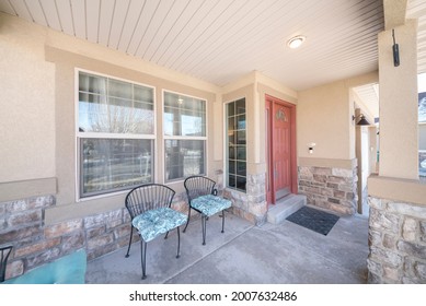 Front Porch Exterior With Two Chairs And Stone Sidings