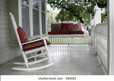 Front Porch With A Rocking Chair And A Porch Swing