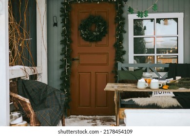 Front Porch Of Rustic Country House In Winter In Snow, Suburban Area With Stylish Decor, Atmosphere Of Christmas And New Year Celebration Background