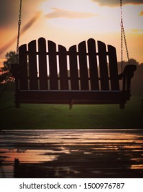 Front Porch Swing During The Sunset.