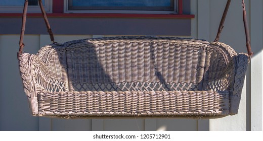 Front Porch With A Swing On A Sunny Day