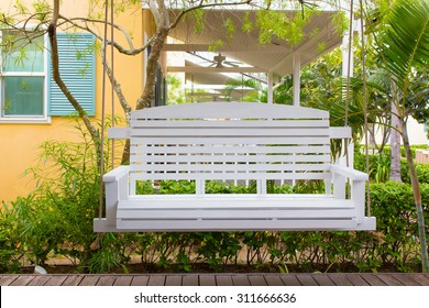 Front Porch With A White Porch Swing,relax Corner