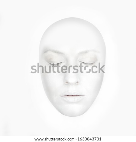Front portrait of the woman with white face like a mask - isolated on white