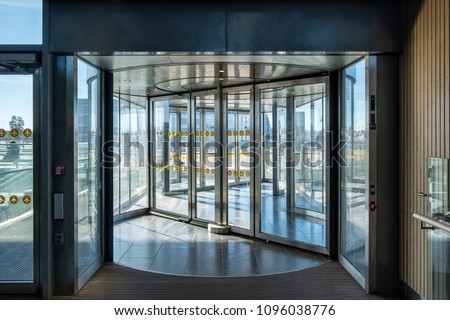Front revolving transparent automatic rotate door in the airport