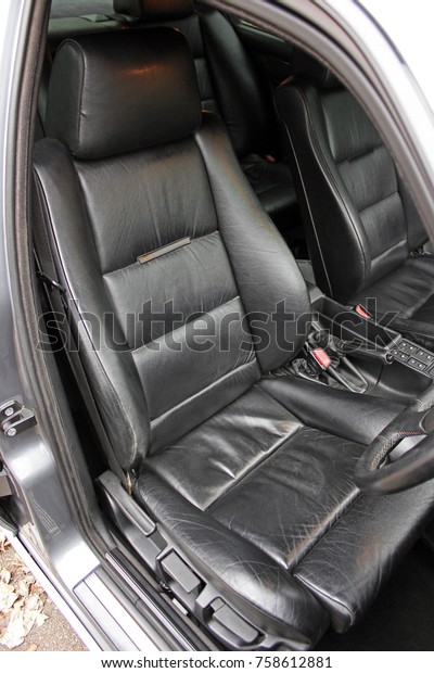 The front\
seats of the car. Leather. The\
black