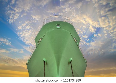 Front Of Ship Green Color, Oil Tanker Ship Forward Both Anchor Chain Hang, Way Forward Success On Blue And Sunlight Background