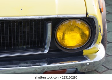 the front side of a car with a light 