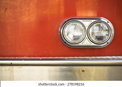 The Front Side Of A Fire Engine Truck With Circle Light