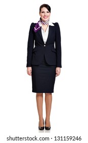 Front Side, Full Body Of A Beautiful Dark Haired Young Business Woman Dressed In A Dark Blue Suit With A Purple Scarf Smiling, Isolated On White Background