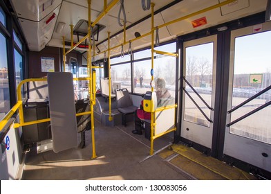 Front side of modern city bus with central doors. Wide angle shot