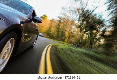 Front side view of speeding car.