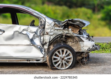 Front of silver car get hard damaged by accident on the road. Maintenance or car repair concept - Shutterstock ID 2229785345