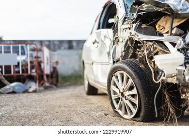 Front of silver car get hard damaged by accident on the road. Maintenance or car repair concept - Shutterstock ID 2229919907