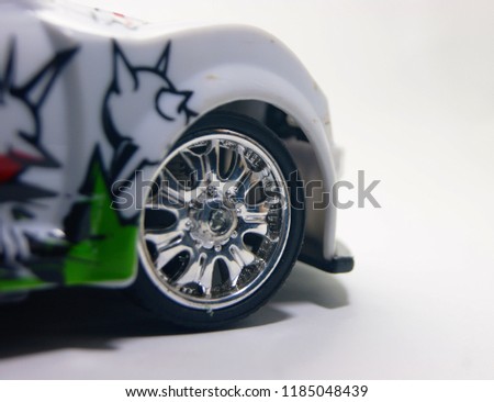 front of sport car toy wheel close up isolated on white background 