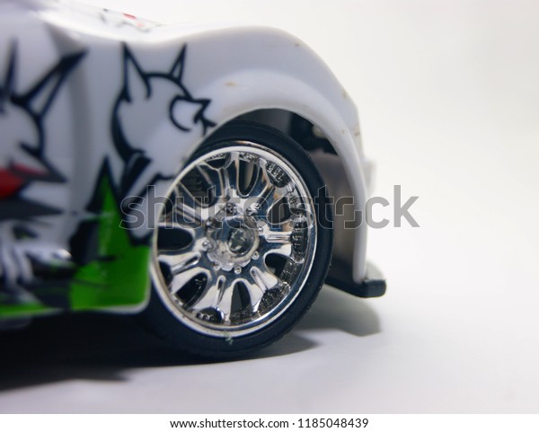 front of sport car toy wheel close up isolated on white
background 