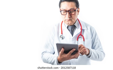 Front Tom Of Doctor In Gown, Stethoscope And Tie Reviewing Information Or Diagnosis On A Tablet On White Background. Medicine And Technology Concept. Good Copyspace