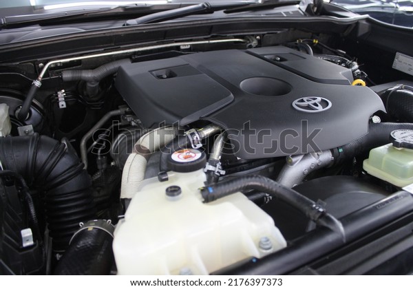 the\
front of the toyota car engine is clean shiny\
black