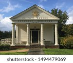 The front of the US Post Office building next to the entrance of Frank Melville Memorial Park in Setauket, Long Island, NY.