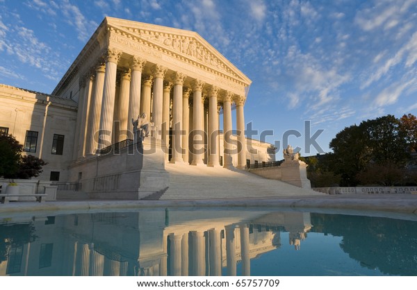 The front of the US Supreme Court in Washington,\
DC, at dusk.