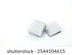 Front view of 2 aluminum heat sinks on a white background. Component part of electronic or computer work.