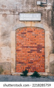 Front View Of An Abandoned Shop. Obstructed Door. 