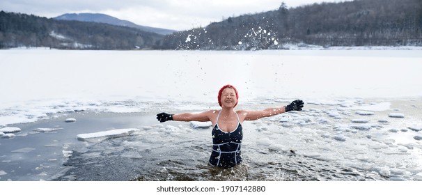 Front View Of Active Senior Woman In Swimsuit Outdoors In Water In Winter, Cold Therapy Concept.