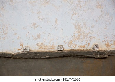 Front view of the Adobe house wall.