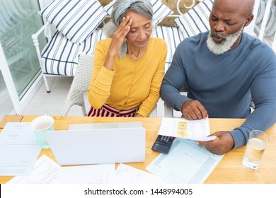 Front View Of African American Couple Calculating Finances. Authentic Senior Retired Life Concept