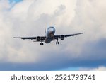 Front view of an Airbus A320 preparing to land on the Josep Tarradellas Barcelona-El Prat airport, at low altitude. Picture taken in the El Prat Airport lookout.