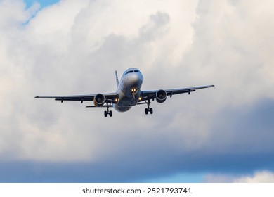 Front view of an Airbus A320 preparing to land on the Josep Tarradellas Barcelona-El Prat airport, at low altitude. Picture taken in the El Prat Airport lookout.