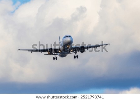 Front view of an Airbus A320 preparing to land on the Josep Tarradellas Barcelona-El Prat airport, at low altitude. Picture taken in the El Prat Airport lookout.