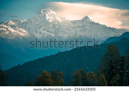 The front view of the Annapurna South peak is covered by snow on top in winter, Mardi Himal trek, Nepal. Clear sky on a sunny day. The idea for a soft-toned nature background with copy space.