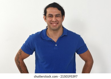 Front View Of Aportrait Of A Man With Tatoo On Amrs Smiling And Looking At Camera On White Background