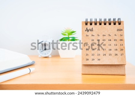 Front view of April desk calendar for 2024 year on worktable.