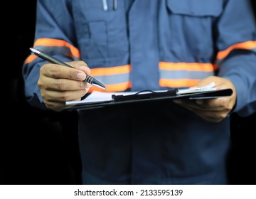 Front View Of Auditor Holding Clipboard And Checklist In Assessment And Inspection On Black Background.